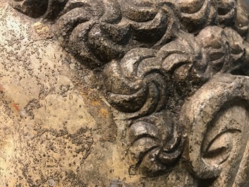A Chinese carved stone head of Buddha with traces of gilding and polychromy, Ming