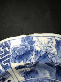 A Chinese blue and white deep plate with fighting warriors on horseback, Kangxi mark and of the period