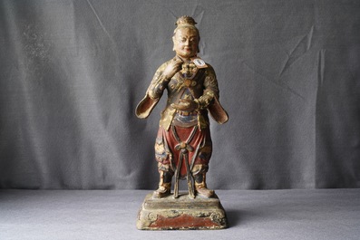 A large Chinese cold-painted bronze figure of a guardian, Ming