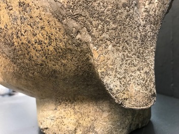 A Chinese carved stone head of Buddha with traces of gilding and polychromy, Ming