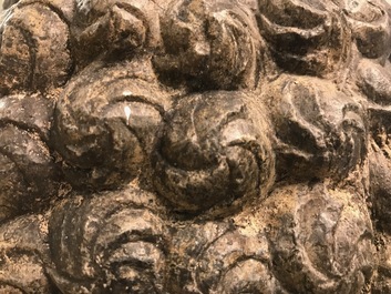 A Chinese carved stone head of Buddha with traces of gilding and polychromy, Ming