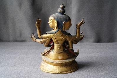 A Sino-Tibetan inlaid gilt copper alloy figure of Ushnishavijaya, 18th C.