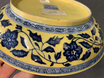 A Chinese yellow-ground blue and white 'lotus bouquet' plate, Qianlong mark, 19/20th C.