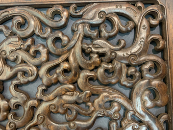 A pair of Chinese reticulated carved wooden panels, 18/19th C.