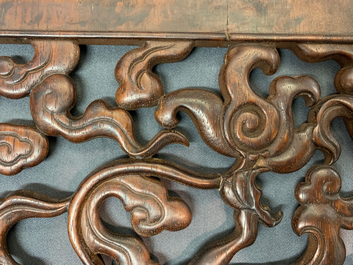 A pair of Chinese reticulated carved wooden panels, 18/19th C.