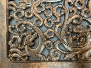 A pair of Chinese reticulated carved wooden panels, 18/19th C.