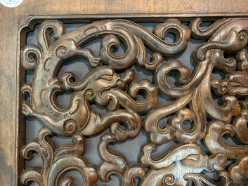 A pair of Chinese reticulated carved wooden panels, 18/19th C.