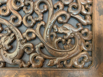 A pair of Chinese reticulated carved wooden panels, 18/19th C.