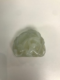 A Chinese celadon jade carving of a peach with two monkeys, 19/20th C.