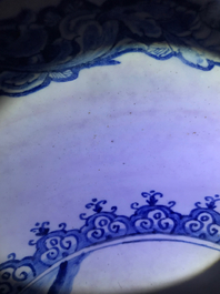 A fine and large Dutch Delft blue and white 'maritime subject' bowl depicting Atlas, 18th C.