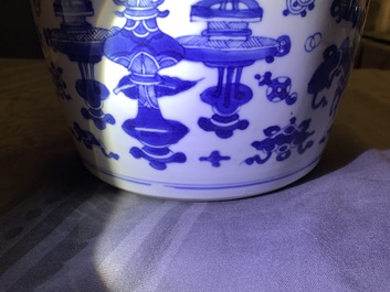 A Chinese blue and white bowl and cover with antiquities design, Kangxi