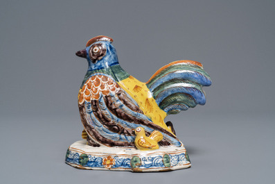 A polychrome Dutch Delft group of a hen with chickens, 18th C.