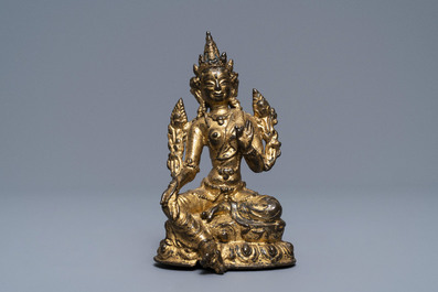 A Sino-Tibetan gilt bronze figure of Green Tara, 17/18th C.