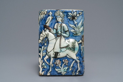 Three Qajar relief-moulded tiles with falconers, Iran, 19th C.