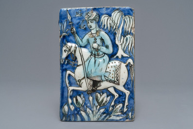 Three Qajar relief-moulded tiles with soldiers on horseback, Iran, 19th C.