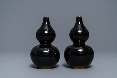 A pair of Chinese dark brown-glazed double gourd vases, Qianlong