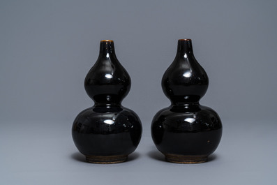 A pair of Chinese dark brown-glazed double gourd vases, Qianlong