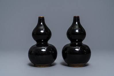 A pair of Chinese dark brown-glazed double gourd vases, Qianlong