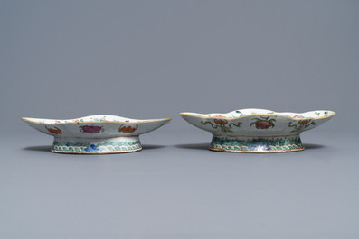 A Chinese blue and white charger and two famille rose bowls, 19th C.