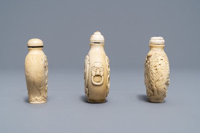 Lot - COMPANION IVORY TAOTIE CARVED SNUFF BOTTLES