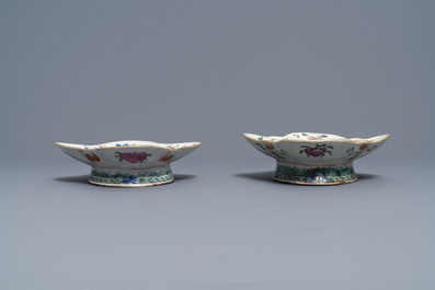 A Chinese blue and white charger and two famille rose bowls, 19th C.