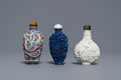 Six Chinese famille rose, blanc de Chine and faux-lapis lazuli relief-decorated snuff bottles, 19/20th C.