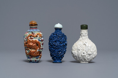 Six Chinese famille rose, blanc de Chine and faux-lapis lazuli relief-decorated snuff bottles, 19/20th C.