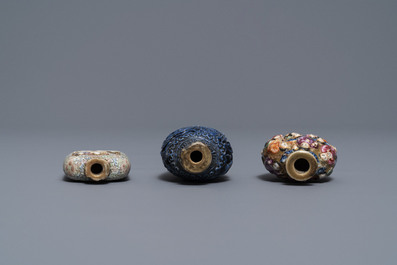 Six Chinese famille rose, blanc de Chine and faux-lapis lazuli relief-decorated snuff bottles, 19/20th C.