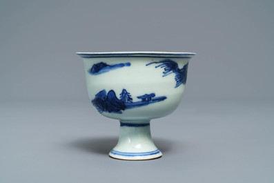 A Chinese blue and white stem cup with landscape design, Transitional period