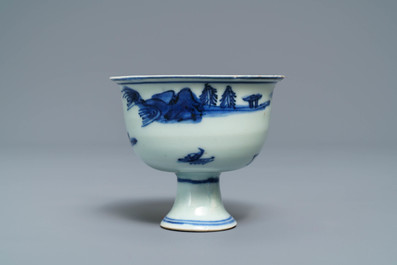 A Chinese blue and white stem cup with landscape design, Transitional period