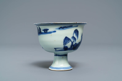 A Chinese blue and white stem cup with landscape design, Transitional period