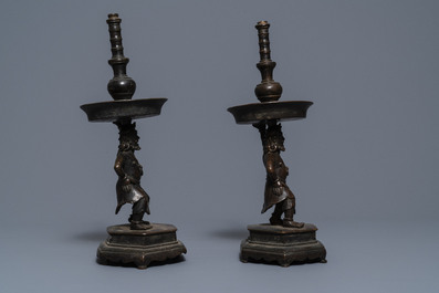 A pair of Chinese bronze candlesticks, Ming