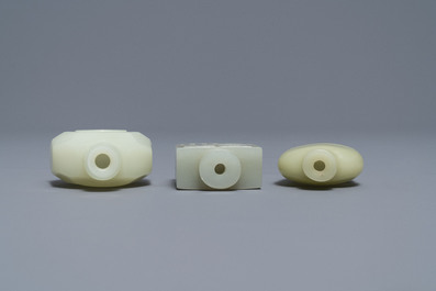 Three Chinese pale celadon jade snuff bottles, 19th C.