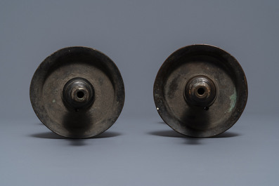 A pair of Chinese bronze candlesticks, Ming