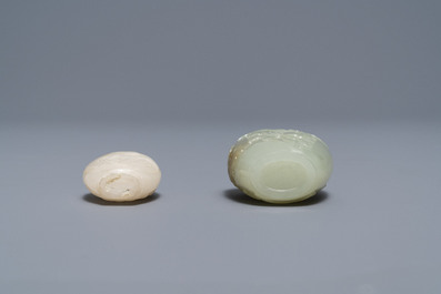 Two Chinese Mughal-style white and celadon jade snuff bottles, 19th C.