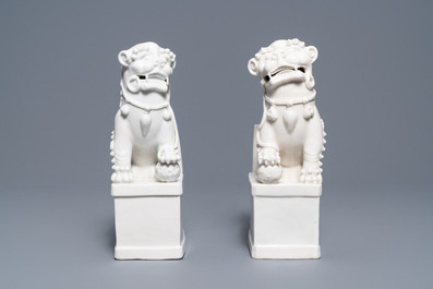 A pair of large Chinese Dehua blanc de Chine buddhist lion joss stick holders, Kangxi