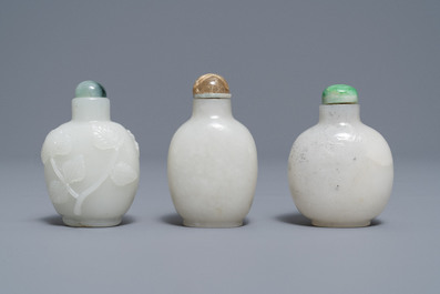 Three Chinese carved pale white jade snuff bottles, 19/20th C.