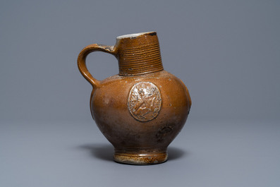 An armorial stoneware jug with unicorns, Raeren, 16/17th C.