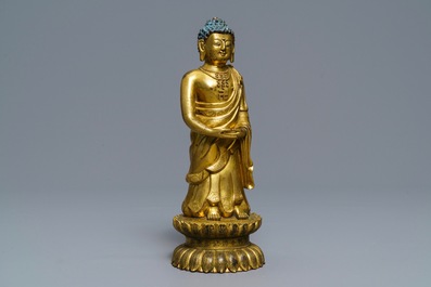 An inscribed Chinese gilt bronze figure of Buddha standing, Qianlong