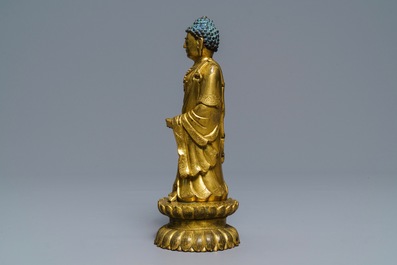 An inscribed Chinese gilt bronze figure of Buddha standing, Qianlong