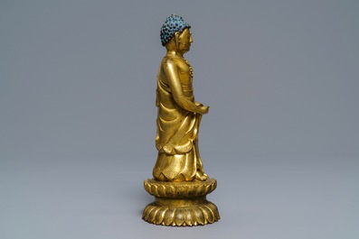 An inscribed Chinese gilt bronze figure of Buddha standing, Qianlong