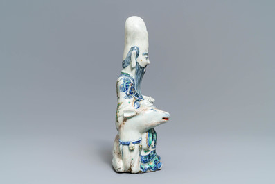 A rare Chinese wucai figure of Shoulao seated on a deer, Wanli