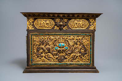 A turquoise-inlaid gilt bronze and copper repouss&eacute; 'tepchog' folding altar table, Tibet, 19th C.