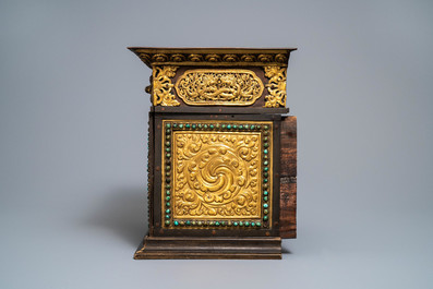 A turquoise-inlaid gilt bronze and copper repouss&eacute; 'tepchog' folding altar table, Tibet, 19th C.