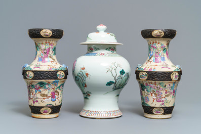 A pair of Chinese famille rose Nanking vases and a covered vase, 19th C.