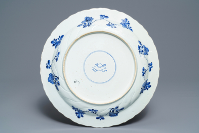A Chinese blue and white moulded dish with a bird among flowers, Kangxi