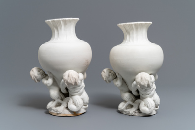 A pair of biscuit vases with young tritons, Saint-Amand or Tournai, 18th C.