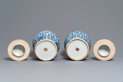 Two pairs of Chinese blue and white vases and covers, Kangxi and Chenghua marks, 19th C.