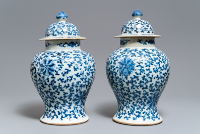 Two pairs of Chinese blue and white vases and covers, Kangxi and Chenghua marks, 19th C.