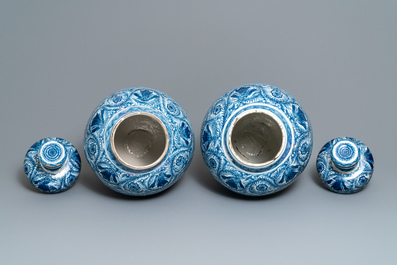 A pair of large Dutch Delft blue and white vases and covers, 18th C.